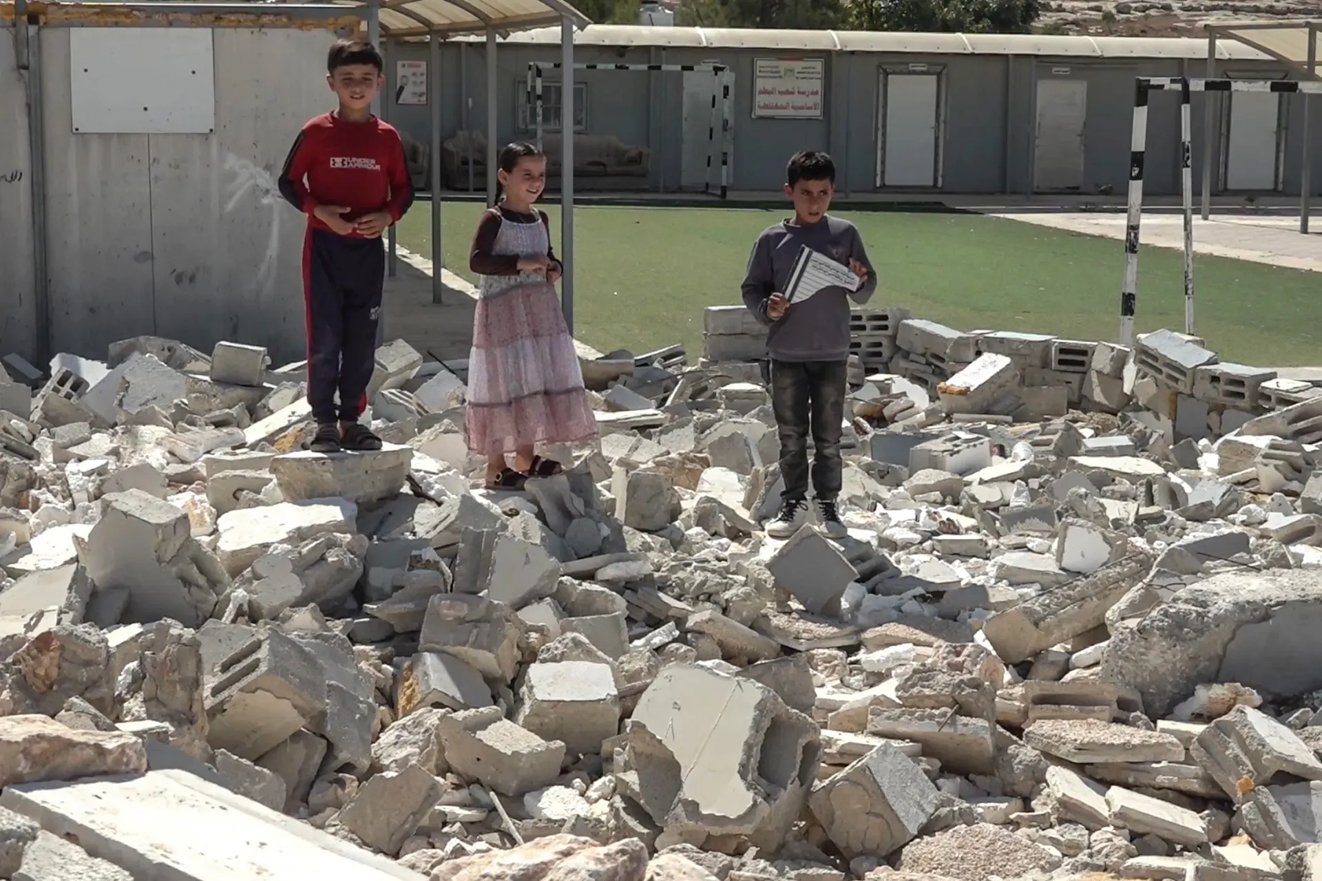 Palestinian children return to school under threat of Israel demolition