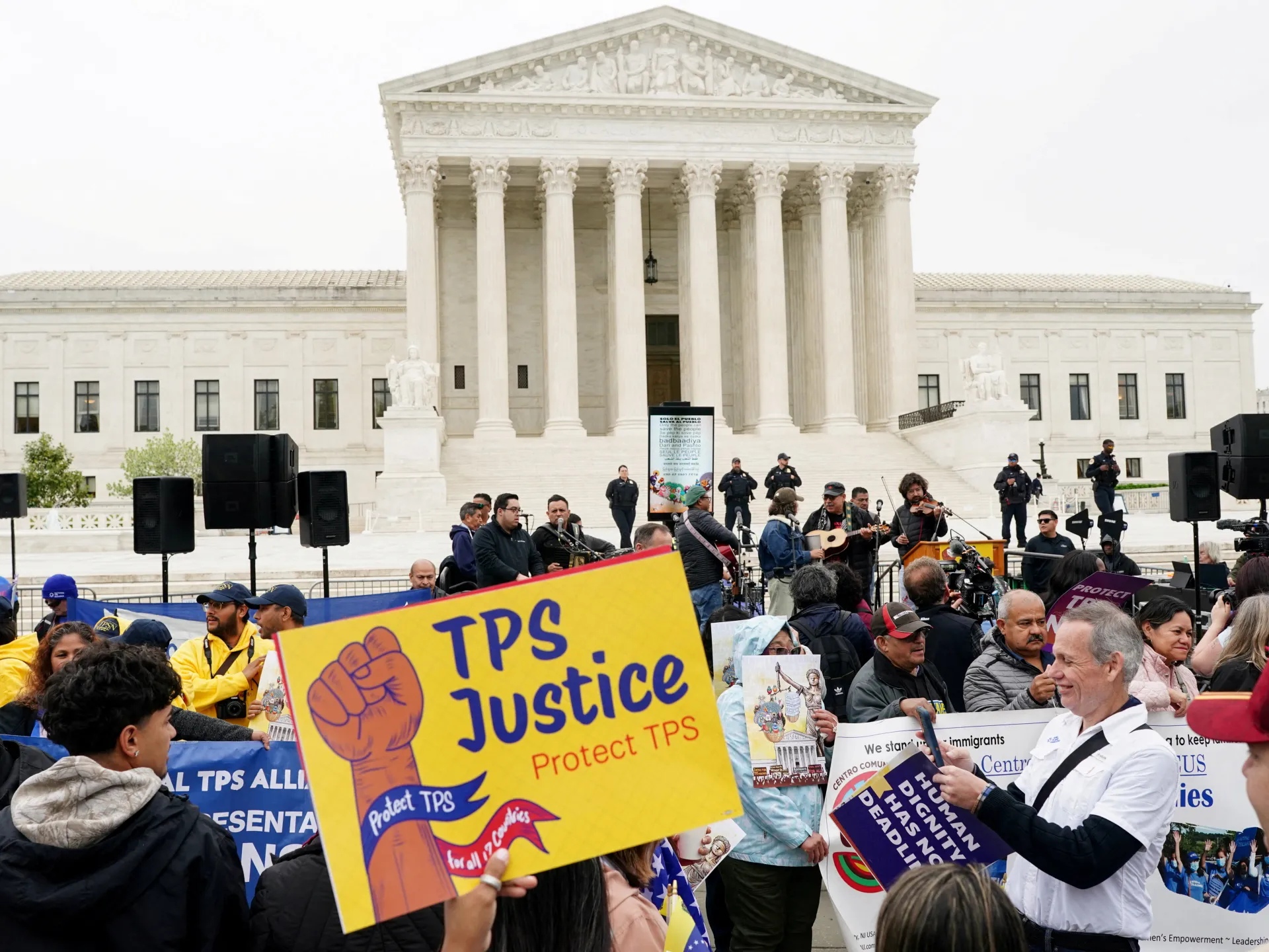 US judge blocks Trump bid to strip work permits from immigrants
